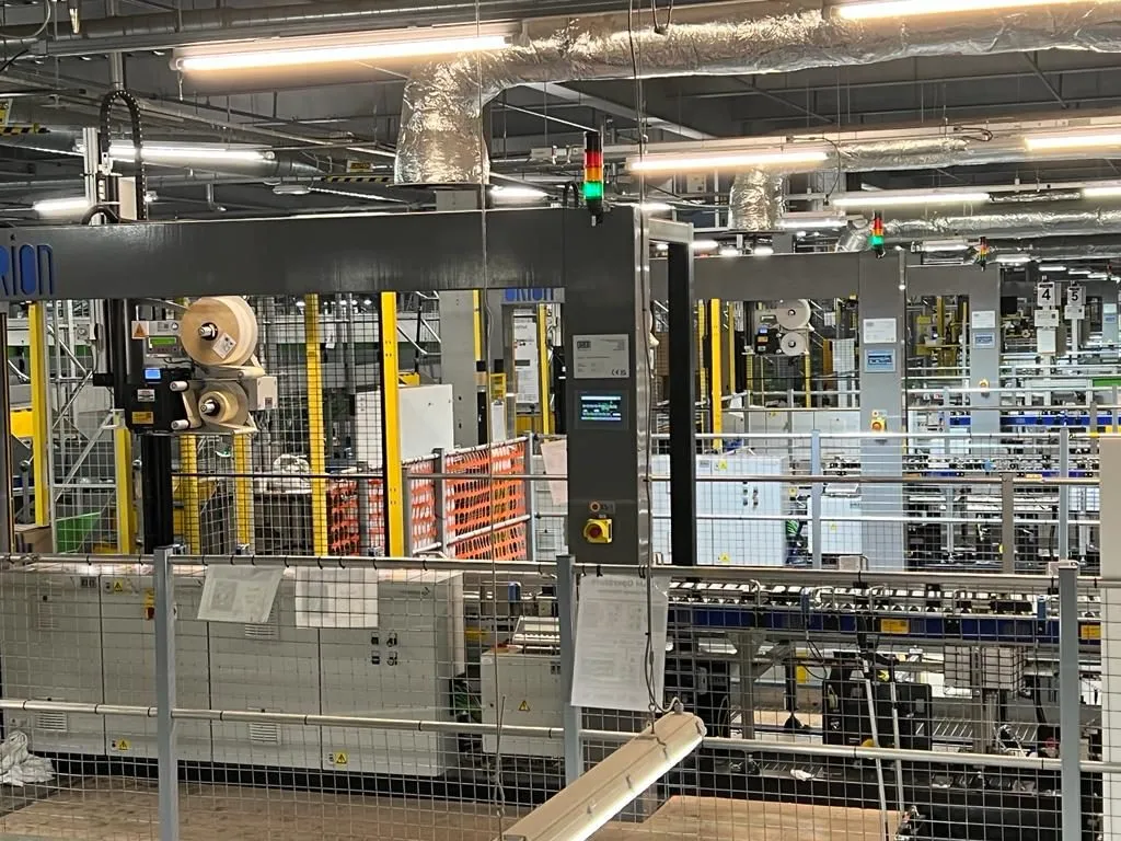 Ten Orion SLAM lines — scan, label, apply, manifest — installed in a live Amazon fulfilment centre
